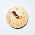 Wooden toy clock with minute and hour in different shades for easy learning