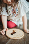 Wooden toy clock with minute and hour in different shades for easy learning